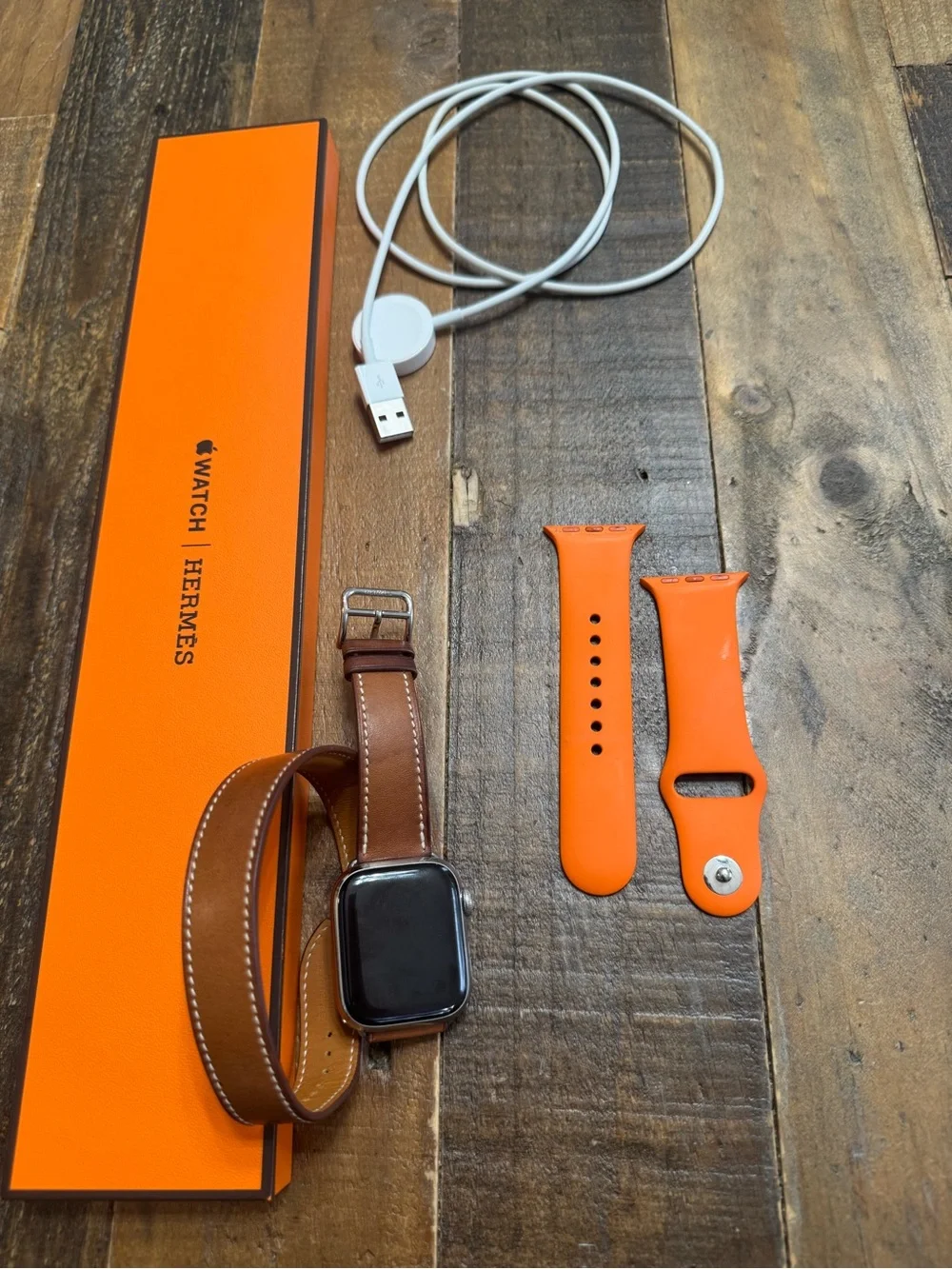 Hermes Apple Watch with orange and double tour leather bands